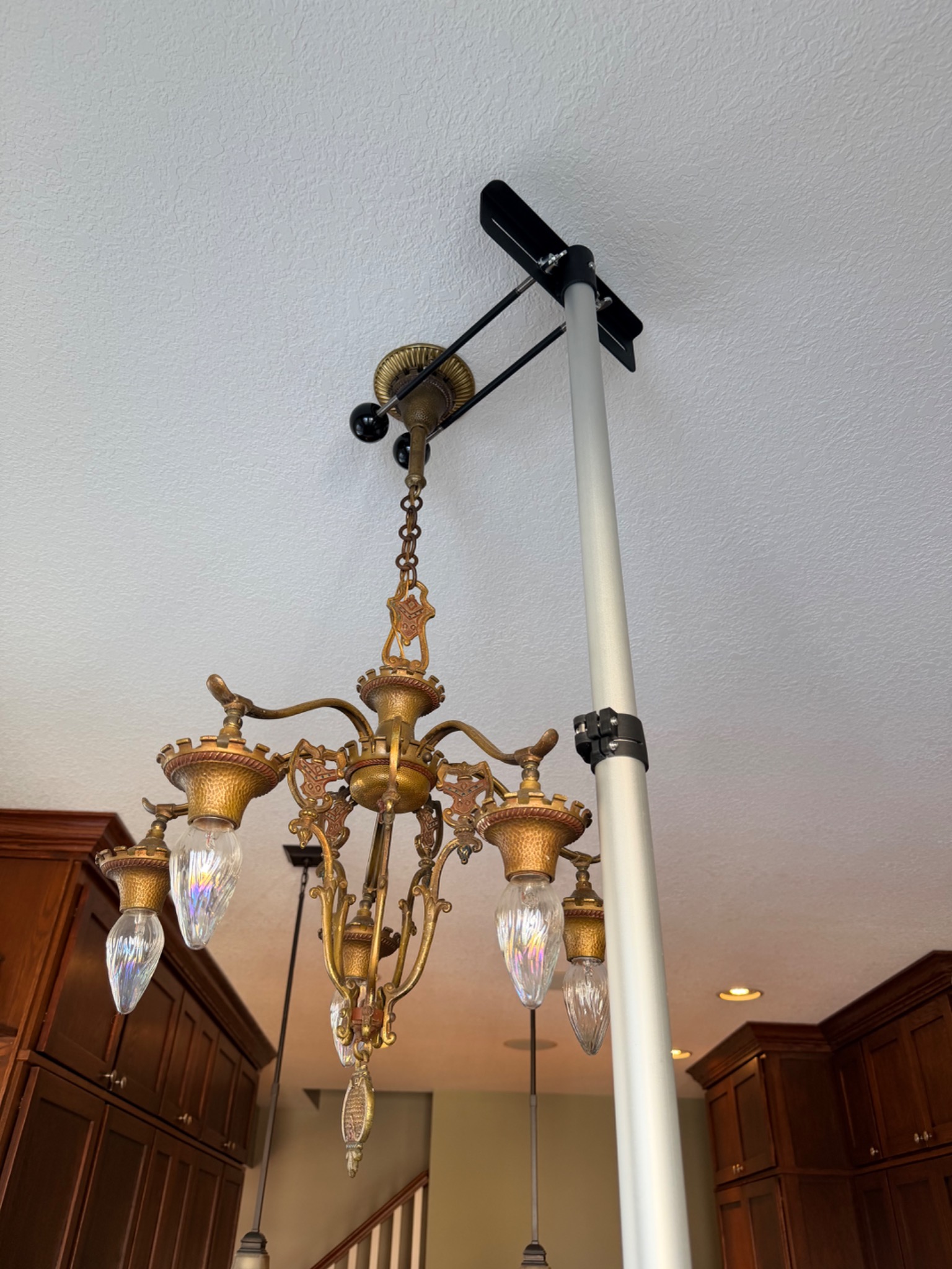 Close view of the fork assembly supporting a chandelier canopy